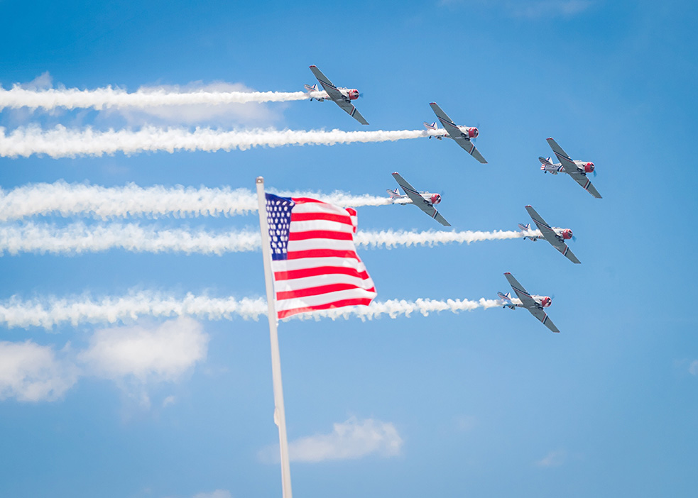 American flag and planes flying past